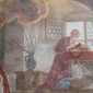 Kirchenfresko mit lesender Figur